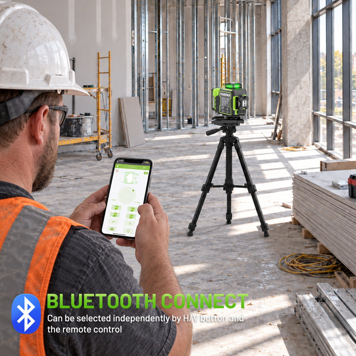 HUEPAR W04CG 4D laser level with Bluetooth connectivity and smartphone app control on a construction site.