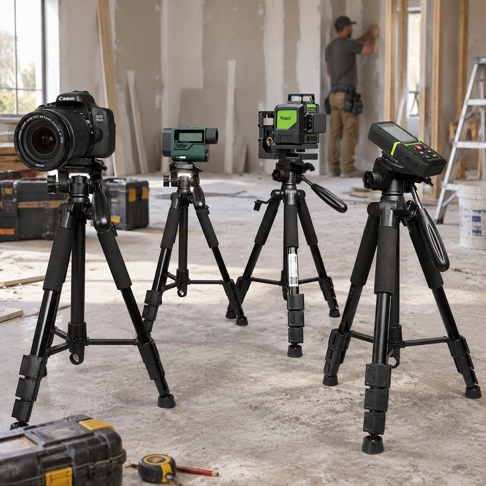 Four surveying and photography devices mounted on tripods at a construction site, demonstrating versatile tripod applications.
