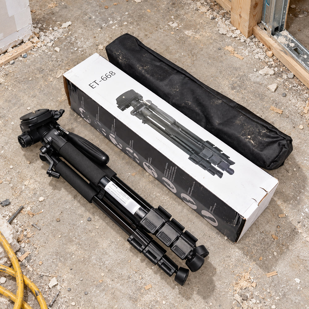Black Huepar ET-608 tripod with a carrying bag and retail packaging.